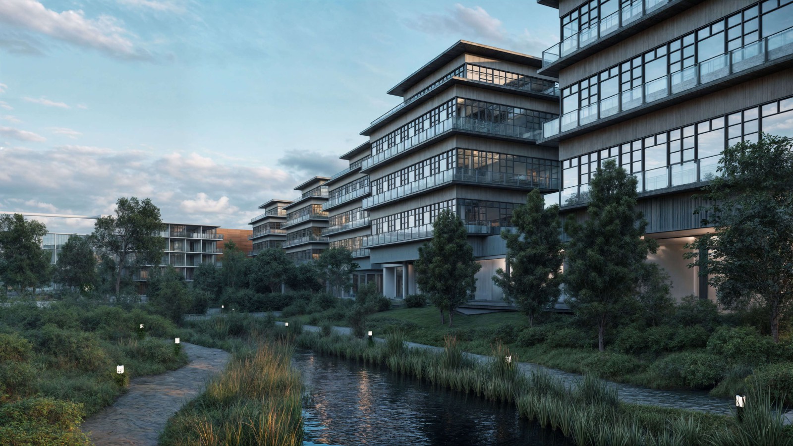 Ansicht der neuen Gebäude auf dem Europarc Dreilinden bei Sonnenaufgang.